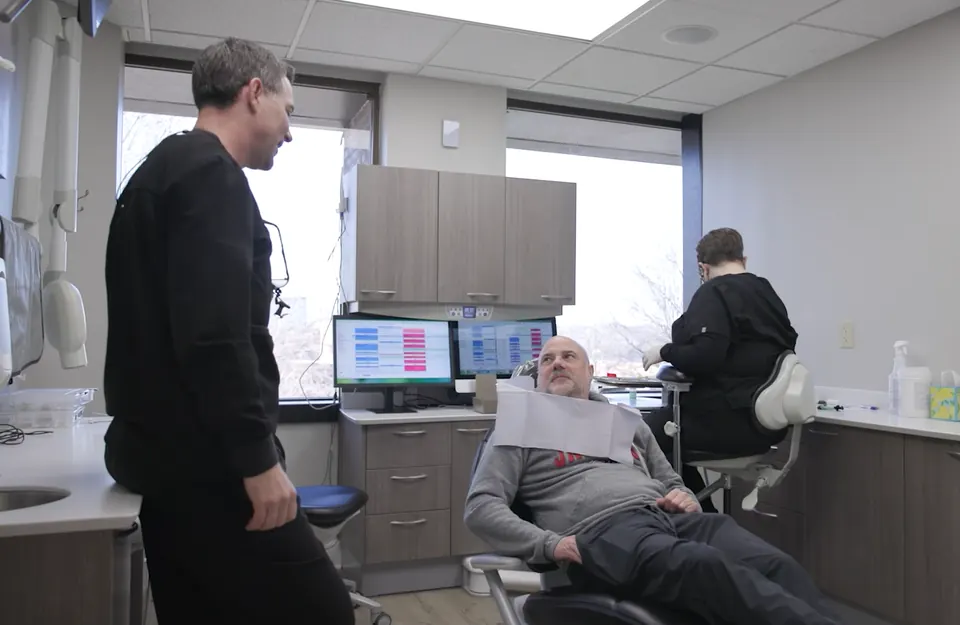 Dr. Lillis with a patient in a private operatory