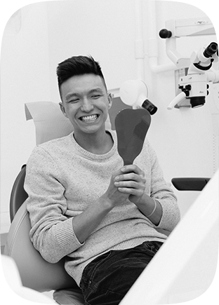 Patient Smiling with Implant Dentures